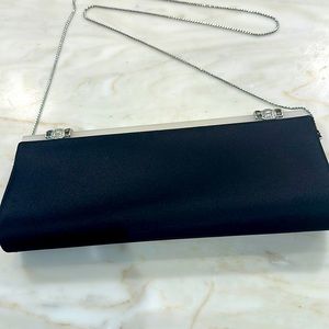 Elegant silk evening bag with rhinestones.”